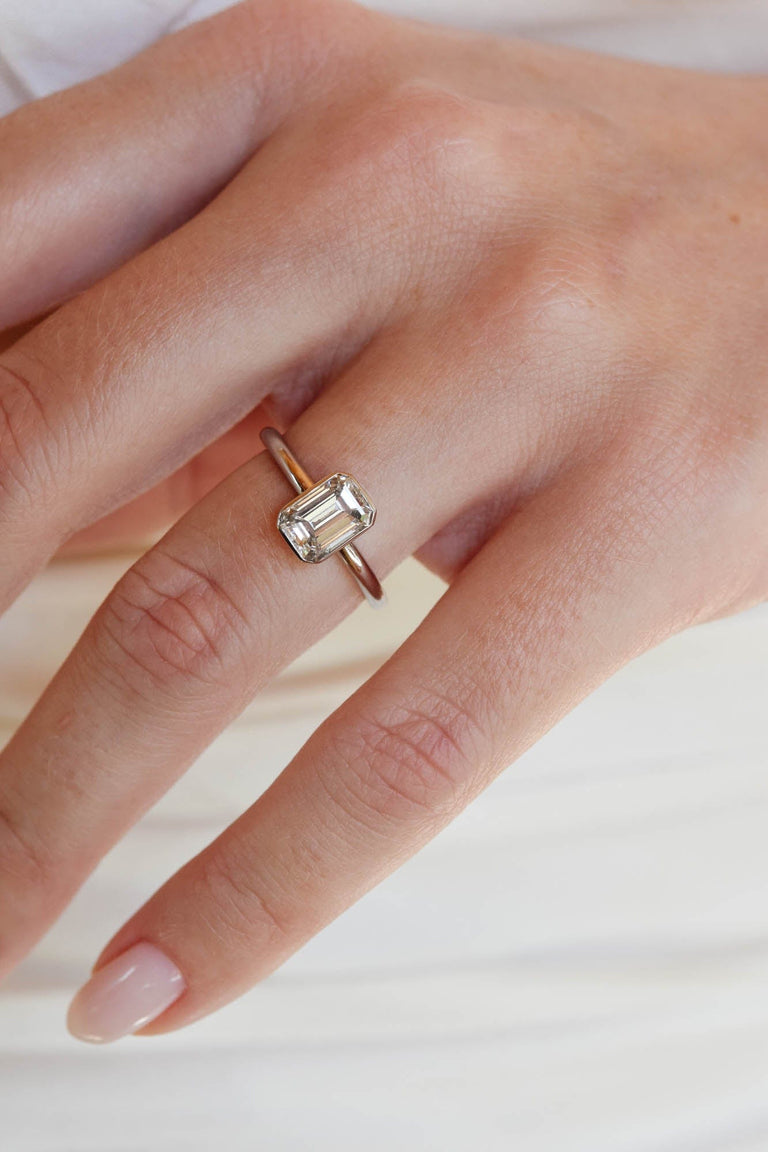 Classic Emerald Cut Diamond Bezel Solitaire 1.22